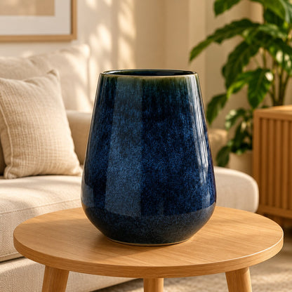 Studio XI Ring Blue tall glossy cobalt glazed ceramic vase on a wooden side table