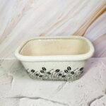 White Ceramic Pot With Leaf Design